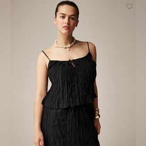 Black crinkled tank top and draw string midi skirt.